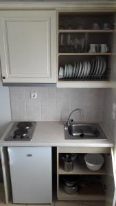 A kitchen or kitchenette at Agiassos Naxos Apartments