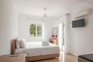 Cama ou camas em um quarto em Studios Angeliki