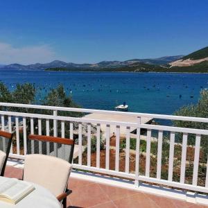 a balcony with a view of a body of water at Holiday Home Blue Dream in Putniković