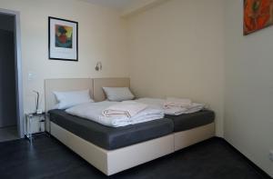 Un pat sau paturi într-o cameră la Hotel Come In