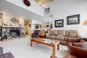 a living room with a couch and a fireplace at 4412 Mackinaw in Wilson