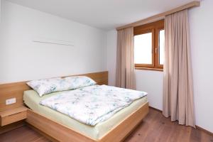 Łóżko lub łóżka w pokoju w obiekcie Apartments Bergleben Goldegg