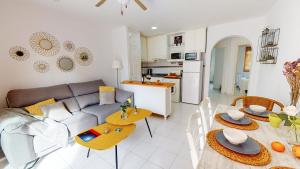 a living room with a couch and a table at Apartamento Jazmin by Family Homes in Denia