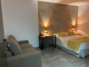 Ein Bett oder Betten in einem Zimmer der Unterkunft HOTEL Boutique ÁNGEL