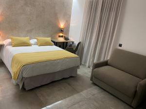 Ein Bett oder Betten in einem Zimmer der Unterkunft HOTEL Boutique ÁNGEL