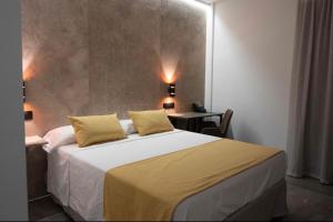 Ein Bett oder Betten in einem Zimmer der Unterkunft HOTEL Boutique ÁNGEL