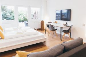 TV a/nebo společenská místnost v ubytování HEIMATEL - Ferienwohnungen