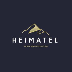 a logo for a real estate company at HEIMATEL - Ferienwohnungen in Scheidegg