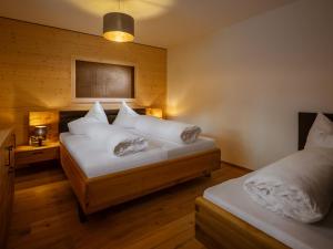 Postel nebo postele na pokoji v ubytování Appartements Bichl ,Haus Ausblick