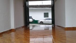 a hallway with a car parked in a garage at Hotel San Agustín in San Agustín