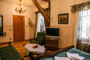 TV a/nebo společenská místnost v ubytování Cantervilla Castle