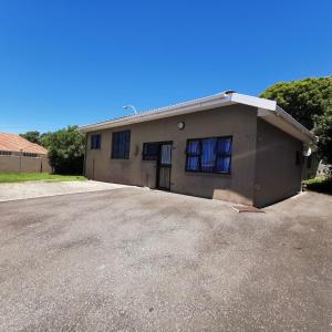 a house with a driveway in front of it at The Hide on Devereux in East London