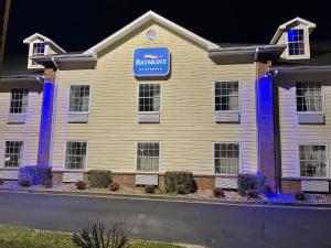 a building with a sign on the side of it at Baymont by Wyndham Adairsville in Adairsville