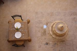 an aerial view of a table and a sea shell at Dar Sitti Aziza in Bethlehem +73 photos