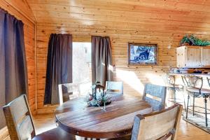 a wooden dining room with a wooden table and chairs at Mountain Top View Retreat in Sevierville +11 photos