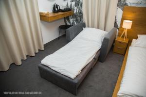 Posteľ alebo postele v izbe v ubytovaní Apartmán u Ričiho-Snowland Valčianska dolina