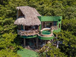 una vista aerea di una casa con tetto in erba di Villa Lala Boutique Hotel Adults Only a Puerto Vallarta