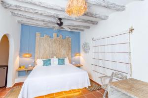 Postel nebo postele na pokoji v ubytování Holbox Dream Beachfront Hotel