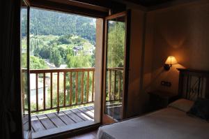 Postel nebo postele na pokoji v ubytování Hotel Bocalé