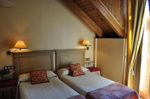 Postel nebo postele na pokoji v ubytování Hotel Bocalé