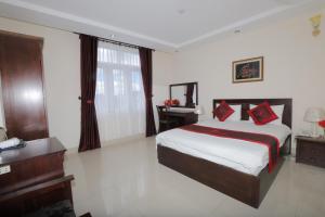 Postel nebo postele na pokoji v ubytování My Hoa 2 Hotel