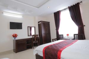 Postel nebo postele na pokoji v ubytování My Hoa 2 Hotel