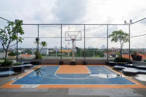a basketball court with a hoop on a building at Modern Spacious Studio Room Apartment at Taman Melati Surabaya By Travelio in Surabaya