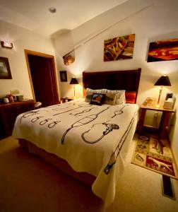 a bedroom with a bed with a white comforter at Hannon House in Darby