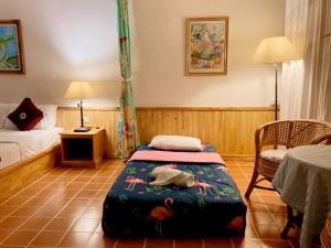 Postel nebo postele na pokoji v ubytování Ekman Garden Resort