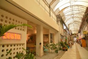 an arcade in a shopping mall with a glass ceiling at LESTEL NAHA in Naha