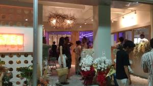 a group of people standing in a store with flowers at LESTEL NAHA in Naha