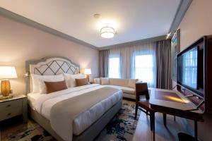A bed or beds in a room at Millennium Istanbul Golden Horn