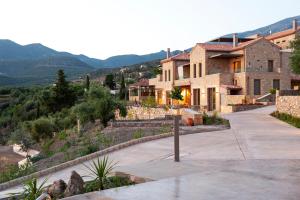 a house with a view of a mountain at Diapori Suites Hotel in Kardamyli