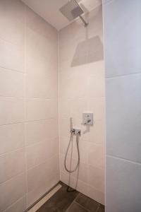 a bathroom with a shower with a shower head at Gasthof Krone in Bissingen