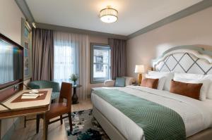 A bed or beds in a room at Millennium Istanbul Golden Horn
