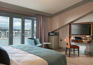 A bed or beds in a room at Millennium Istanbul Golden Horn