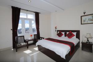 Postel nebo postele na pokoji v ubytování My Hoa 2 Hotel