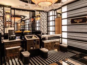 a lobby of a fashion store with a cash register at APA Hotel Shin Osaka Minamikata Ekimae in Osaka
