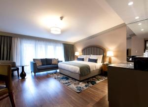 A bed or beds in a room at Millennium Istanbul Golden Horn