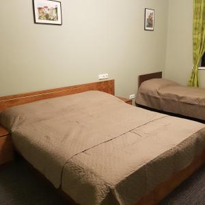 Postel nebo postele na pokoji v ubytování Goodwin Guest House