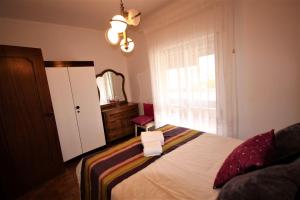 En eller flere senge i et værelse på Apartamento Brás