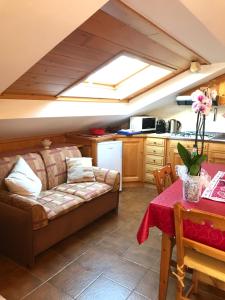 a living room with a couch and a table at Chalet Stelvio in Bormio