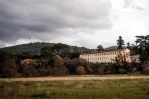 a large building in the middle of a field at La suite de Mont-Vert (Jacuzzi privatif) in Saint-Zacharie