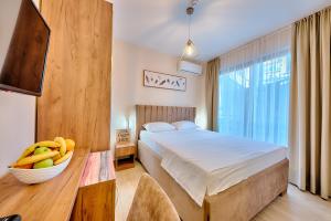 Postel nebo postele na pokoji v ubytování Sunset Hotel