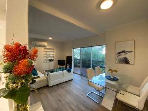 a living room with a couch and a table at Panorama B&B in Naracoorte