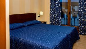 Кровать или кровати в номере Hotel Rural El Jardin