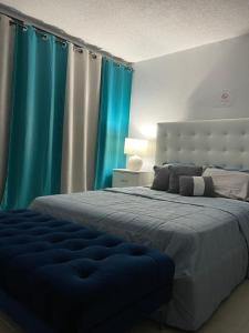 Villa Marina Village Apartment tesisinde bir odada yatak veya yataklar