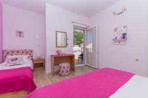 Ένα ή περισσότερα κρεβάτια σε δωμάτιο στο Apartments Luce