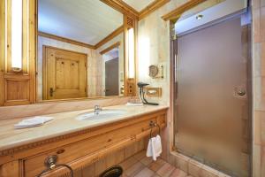a bathroom with a sink and a shower at Parkhotel Wallgau in Wallgau