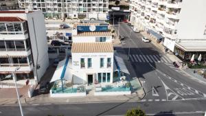 an aerial view of a city street with a white building at Ocean Lounge in Altea